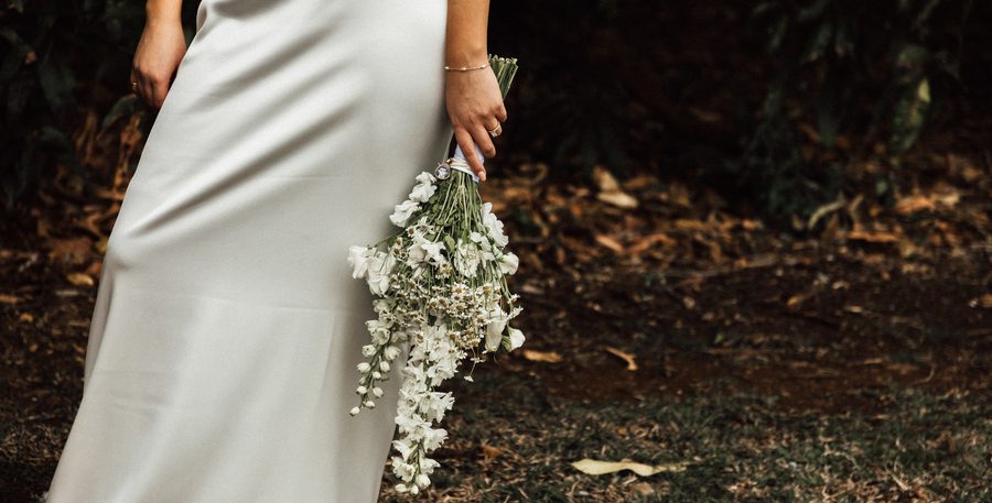 A bride holding her classic bouquet