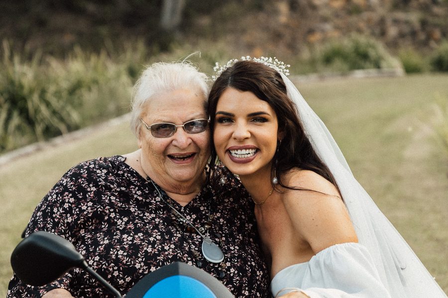 A beautiful bride hugging her grandmother