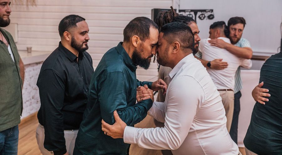 A new Groom gives one of his guests a Hongi at his NZ Wedding